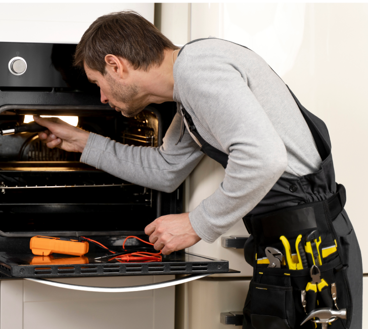 a man looking at an oven